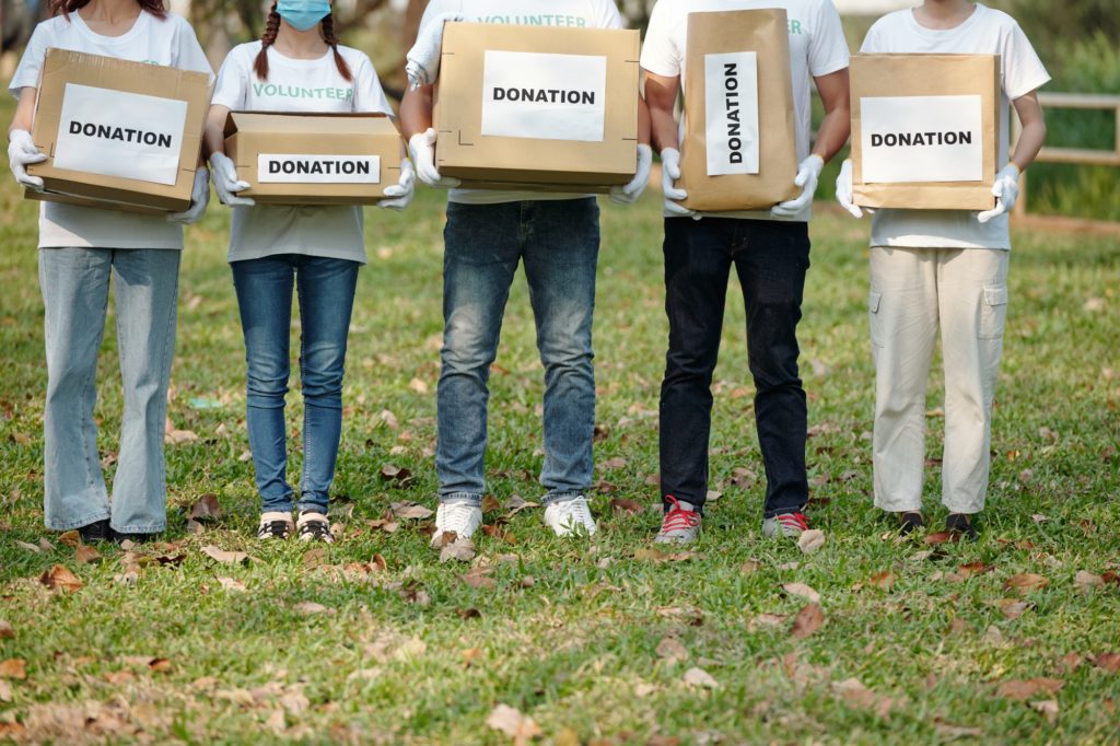 Volunteers with donation boxes